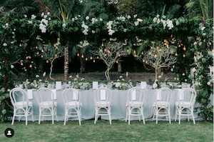 Canopy with Greenery Florals and Hanging Lighting